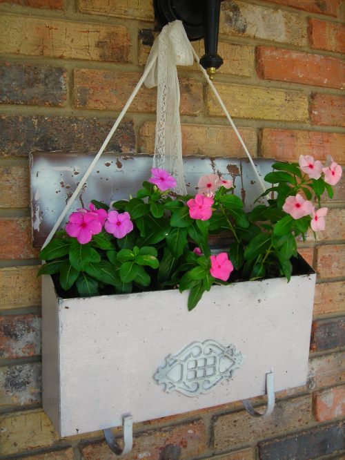 old mailbox, painted redo by sue. decided to make it a planter, for the helluva it. LOVE the results!!