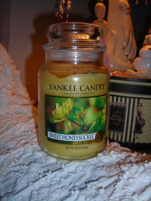 and finally, from the same sale, a (damn) yankee candle ... sweet honeysuckle. smells SOOO divine. and yes, it appears to have been lit a time or two (who among us hasn't been?!) but it's still almost new. and for free, who's complaining?